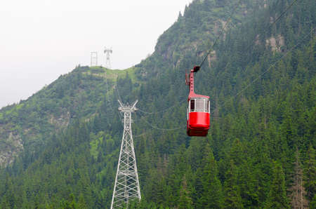 Cable car cabin in mountains in summer at Transfagarasan roadの写真素材