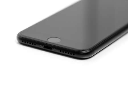 iPhone 7 black matte new Apple product detail of lightning and stereo speaker isolated on whiteのeditorial素材