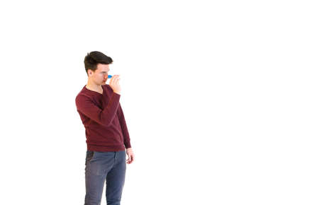 Teenager man wearing a sweater hits when play darts isolated on white background