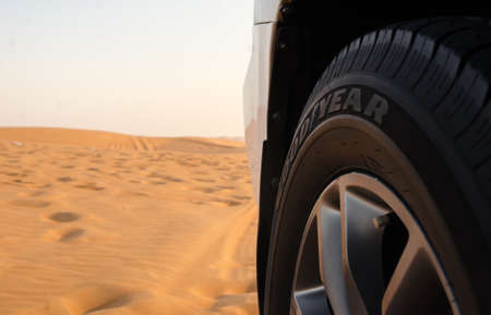9 SEPTEMBER 2017, Dubai UAE - Goodyear new tyre on SUV in desert ready for dune bashingのeditorial素材