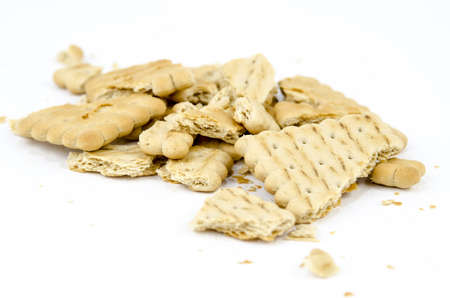 Sweet food - Bakery - Pieces of biscuits with crumbs - Isolated on whiteの写真素材