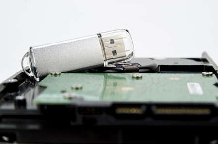 Harddisk and usb drive isolated on white background