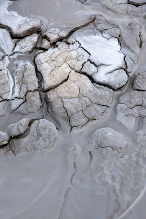Mud Volcanoes - Texture and eruption -Romania, Buzau, Berca - Active Mud Volcanoes, Muddy Volcanoes Reservation in Mountains, View Landmark for Tourists, Landscape (unique geological phenomenon in Europe where the earth gas reaches the surface through hilの写真素材
