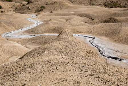 Romania, Buzau, Berca - Active Mud Volcanoes, Muddy Volcanoes Reservation in Mountains, View Landmark for Tourists, Landscape (unique geological phenomenon in Europe where the earth gas reaches the surface through hills making small Mud volcanoes)の写真素材