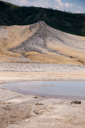 Romania, Buzau, Berca - Active Mud Volcanoes, Muddy Volcanoes Reservation in Mountains, View Landmark for Tourists, Landscape (unique geological phenomenon in Europe where the earth gas reaches the surface through hills making small Mud volcanoes)の写真素材