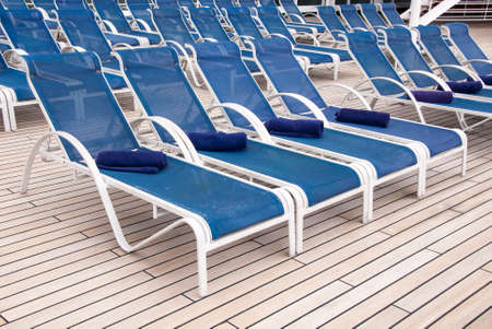 Towels Placed On Lounge Chairs On Deck Of Cruise Ship