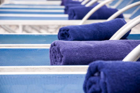 Towels Placed On Lounge Chairs On Deck Of Cruise Ship