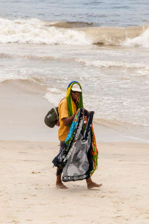 A seller of Brazilian souvenirs on the beach in Copacabana, Rio de Janeiro - Brazil - December 19th 2013のeditorial素材