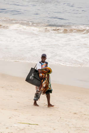 A seller of Brazilian souvenirs on the beach in Copacabana, Rio de Janeiro - Brazil - December 19th 2013のeditorial素材