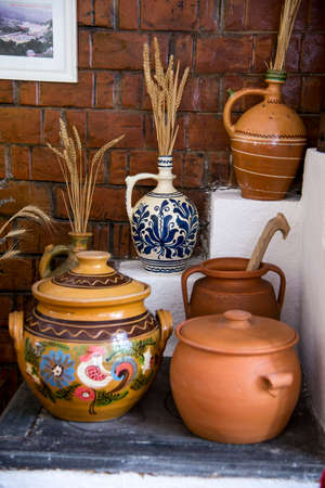 Traditional Romanian earthenware pottery in Buzau - Romania. Romanian pottery is traditionally...