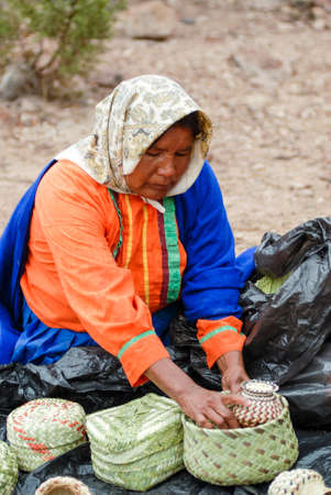 Tarahumara Indian woman selling handwoven baskets and other handicrafts. March 03, 2010 - Copper...
