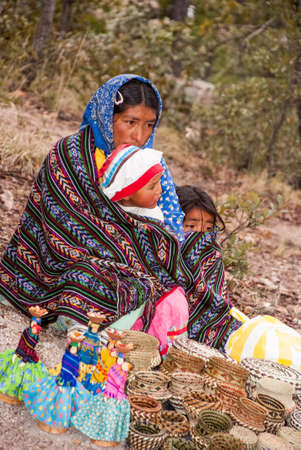 Tarahumara Indian woman selling handwoven baskets and other handicrafts. March 03, 2010 - Copper...