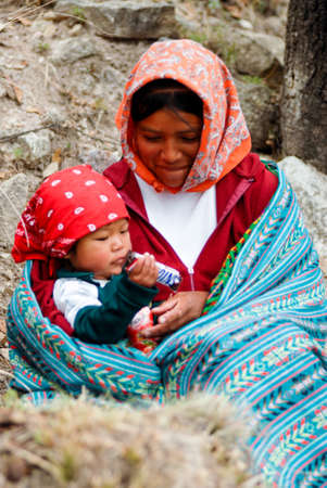 Tarahumara Indian family - mother and kid in Copper Canyon. March 03, 2010 - Copper Canyon - Sierra Madre, Chihuahua State, Mexico, South Americaのeditorial素材