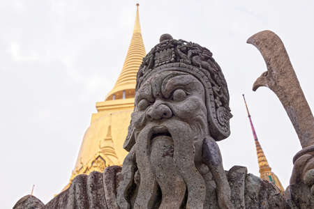 Chinese stone guardian statue at Wat Phra Kaew Temple of the Emerald Buddha, Grand Palace, Bangkok,...