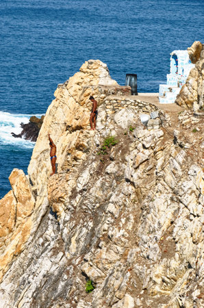 Cliff diver, a clavadista, diving off the cliffs at La Quebrada, Acapulco, Guerrero State, Mexico - 11th of January 2011のeditorial素材