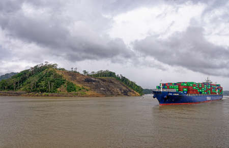 A Large Container Ship Ital Lunare Passing Through Gatun Lake Of The Panama Canal - Gatun Lake, Panama Canal, Panama, Central America - 25th ofJanuary 2011のeditorial素材