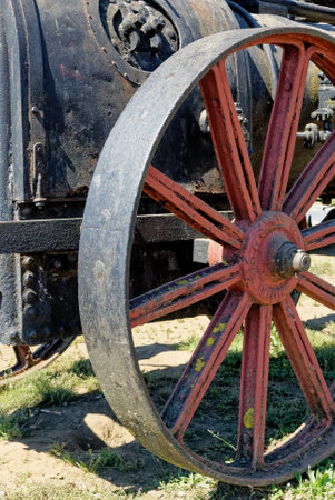 Detail of steam locomotives old rusty wheel at the seaside promenade in Castro City, Chiloe Island, Chile. 16th of February 2014の写真素材