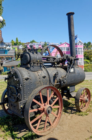 Old rusty steam locomotives at the seaside promenade in Castro City, Chiloe Island, Chile. 16th of February 2014のeditorial素材