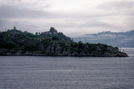 Fjord coastline close to Bergen - Norway. Fjord landscape in a cloudy day at Bergen, Norway, Scandinavia, Northern Europeの写真素材