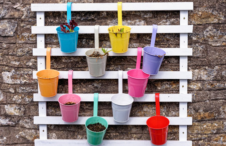 Rustic garden pots in the Village of Nunney in a sunny day, Somerset, England, United Kingdom - 8th of April 2023のeditorial素材