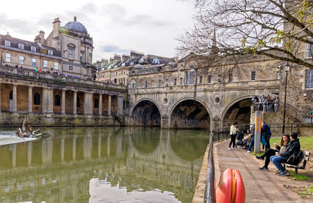 Travel destination United Kingdom - The Weir and Pulteney Bridge on river Avon in Bath, Somerset, England - 8th of April 2023のeditorial素材