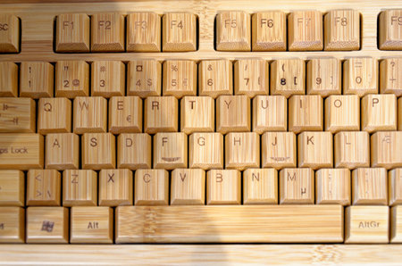 Closeup view on an old wooden computer keyboard - Vintage art and technology