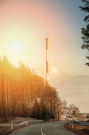 Red chimney and forest.の写真素材