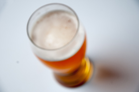 Glass of light beer without showing focus alcoholism. On a white background.の写真素材