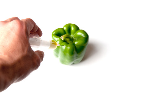 GMO green pepper and syringeの写真素材