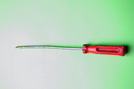 The image of screwdrivers on a green backgroundの写真素材