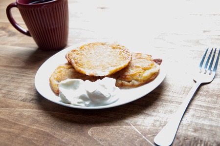 Potato pancakes on a wooden tableの写真素材