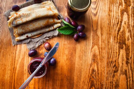 Pancakes and fresh plum jam.の写真素材