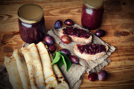 Sandwich and pancakes with fresh plum jam.の写真素材