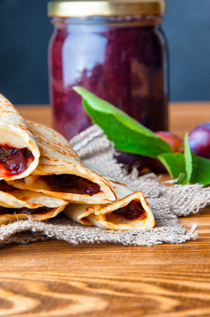 Pancakes and fresh plum jam.の写真素材