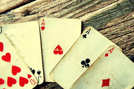 Playing cards on a wooden background.の写真素材