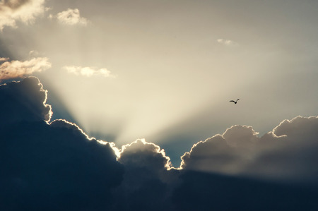 light from behind the clouds.の写真素材