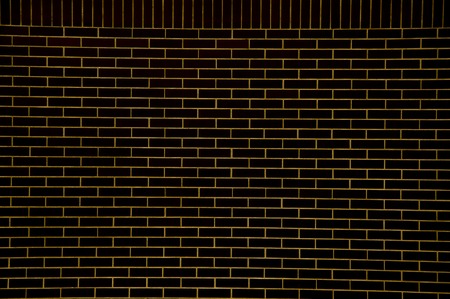 Black brick wall background with copy spaceの写真素材