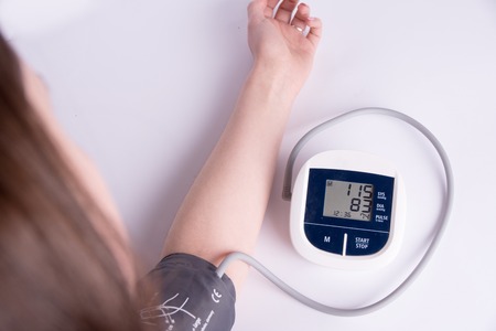 measuring blood pressure on a white background.