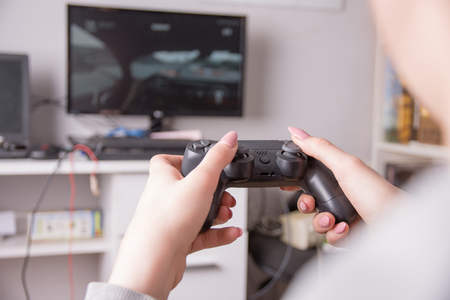 girl is raining gaming and playing on the console.