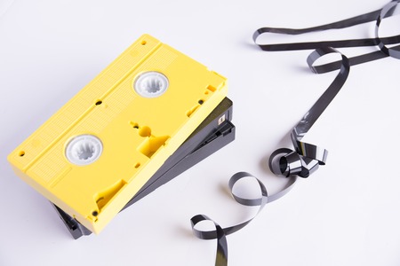 cassettes and around them a tape of damaged oneの写真素材