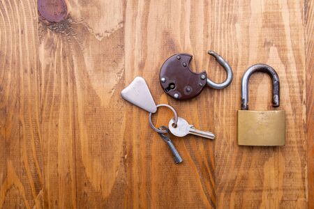 Old padlock on a wooden door
