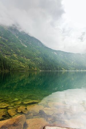 Sea eye in the Polish Tatra Mountains. The best place for tourists.の写真素材