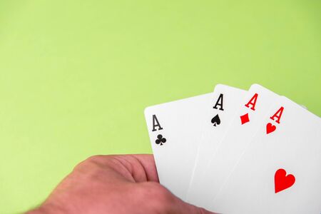 Four aces on green background. Concept of gambling riskの写真素材