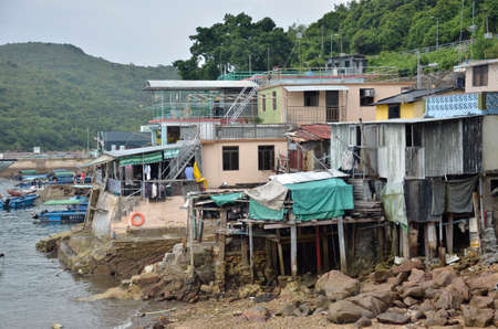 Houses on stilts above the tidal flats of Lantau Island are homes to the Tanka people in Tai O, Hong Kong These unusual structures are interconnected, forming a tightly knit fishing community that literally lives on the water for generationsのeditorial素材