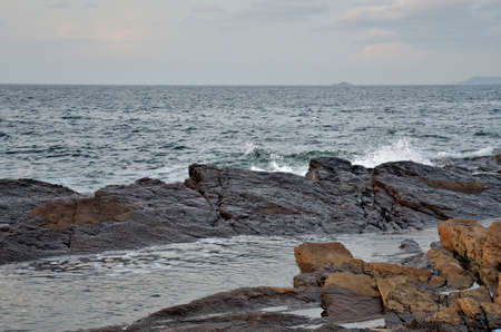 Big waves and huge water splash on rocky coast and seashoreの写真素材