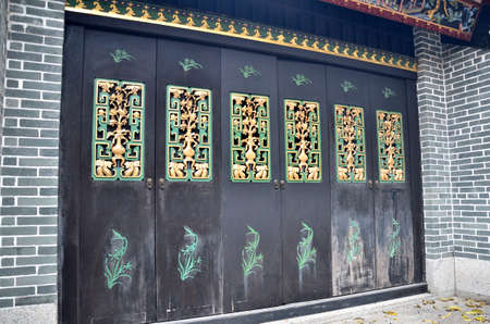 Old wooden door with chinese traditional style patternの写真素材