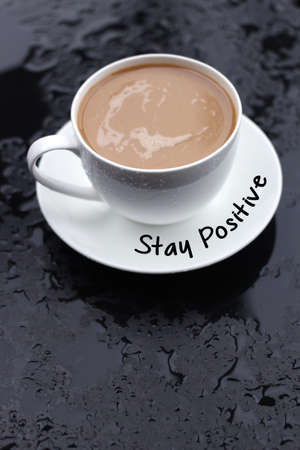 Stay Positive concept with coffee cupの写真素材