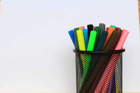 Colorful pen in the pen-holder cupの写真素材
