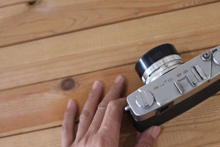 hand holding vintage camera