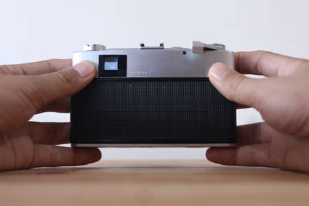 hand holding vintage camera